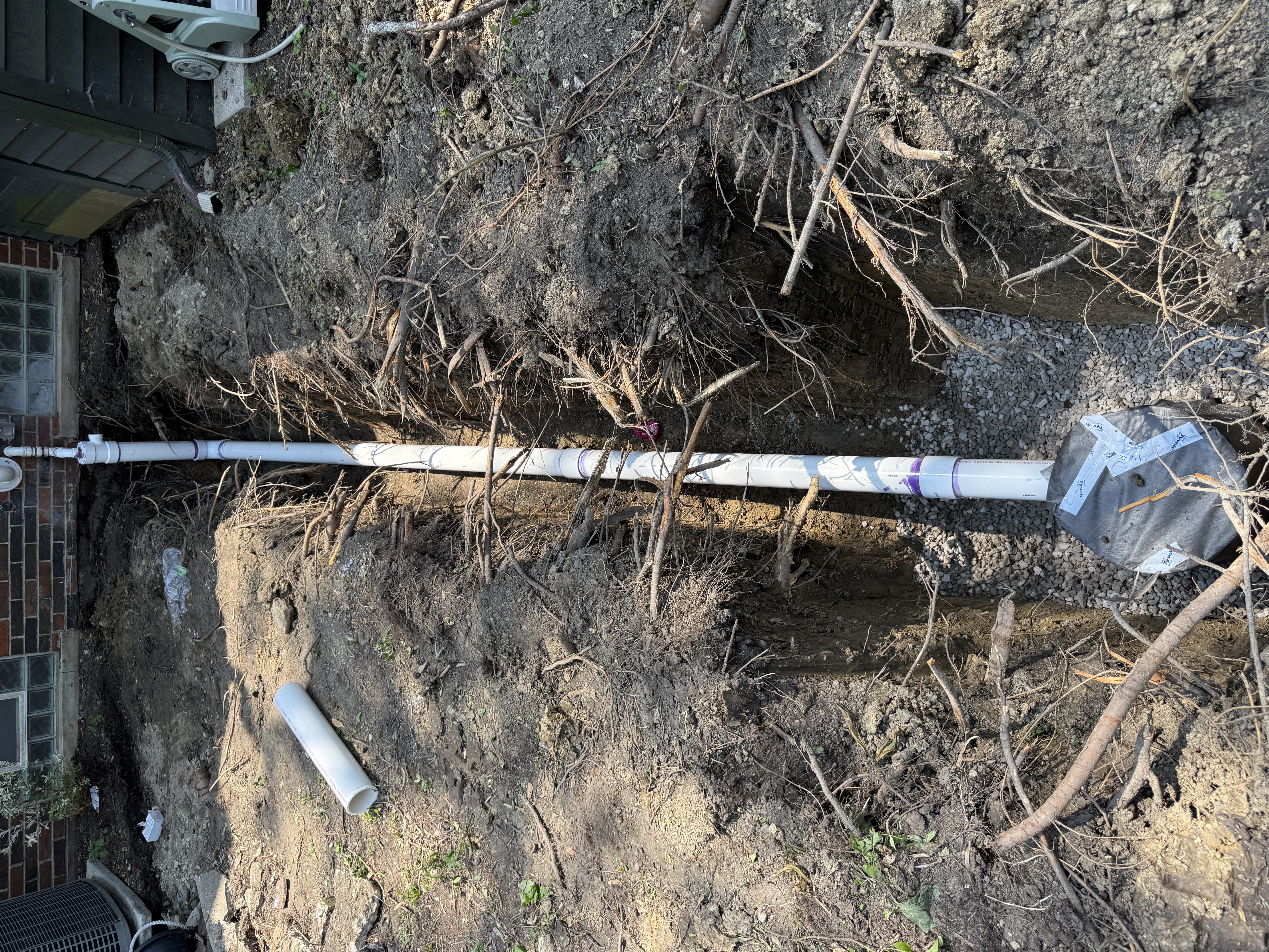 Exterior sump pump discharge system