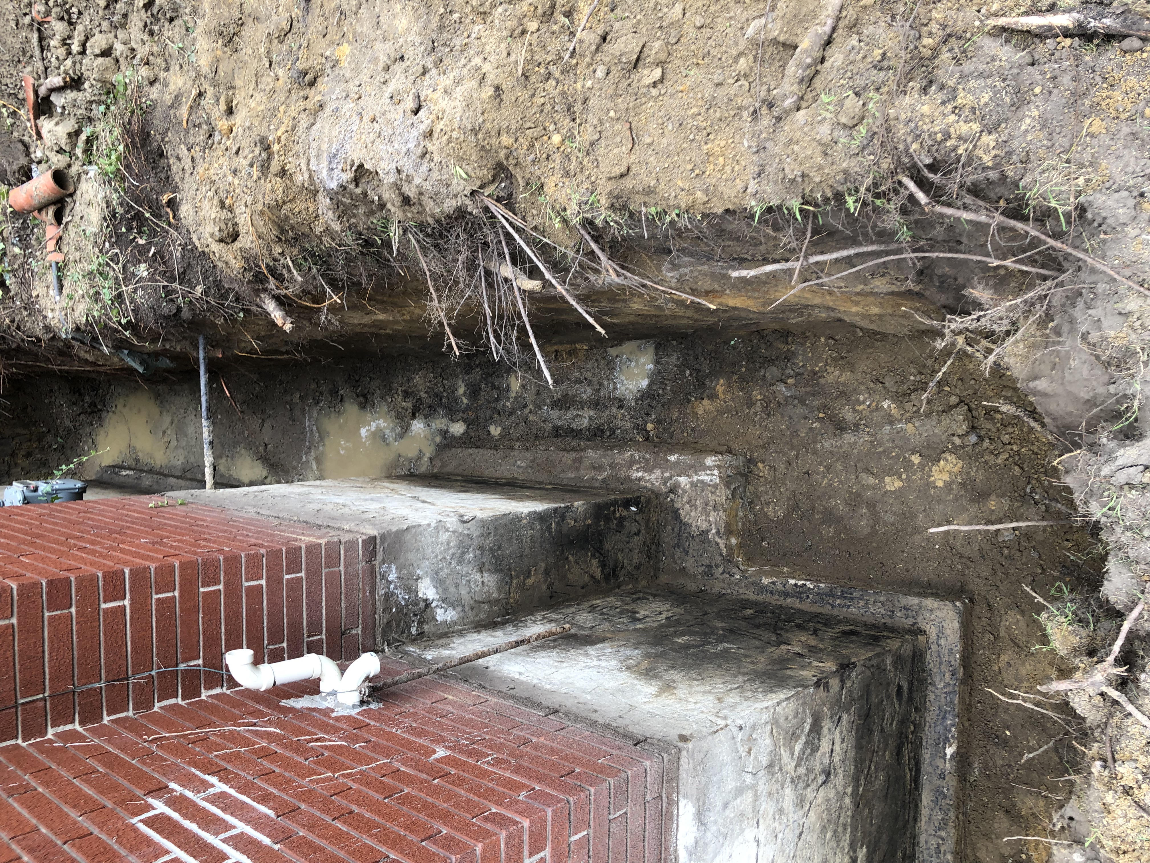 Foundation waterproofing in progress
