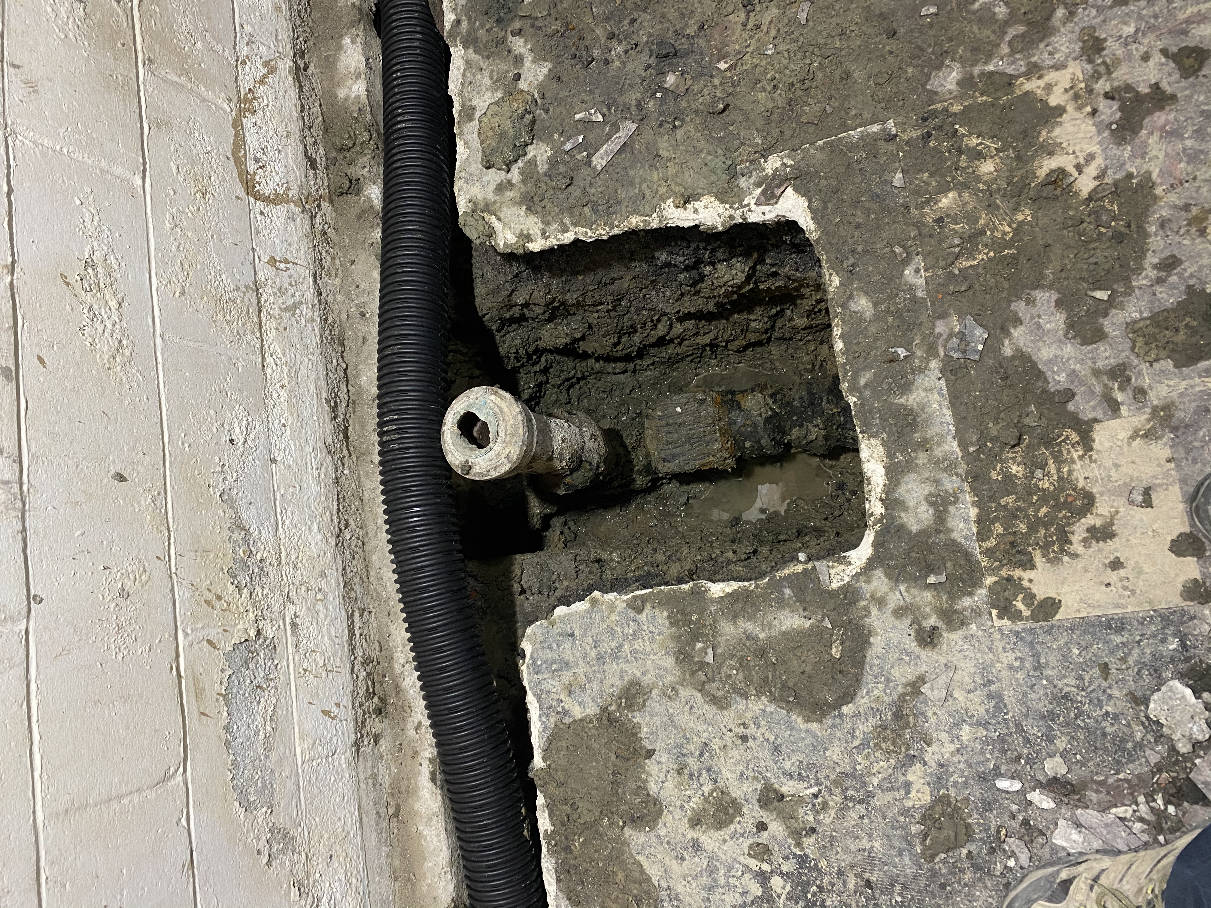 Sump pump discharge through wall