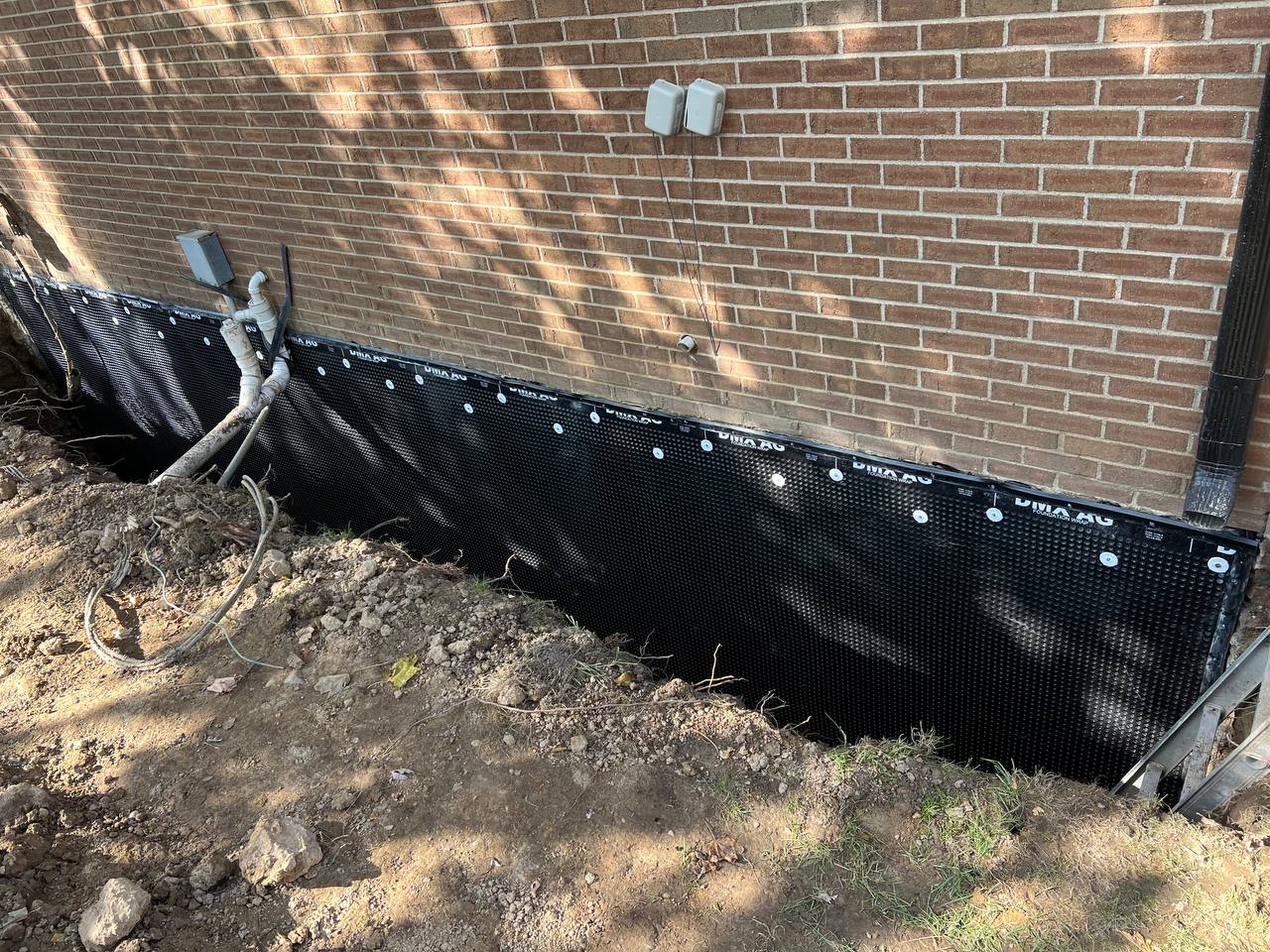 Exterior foundation waterproofing in progress