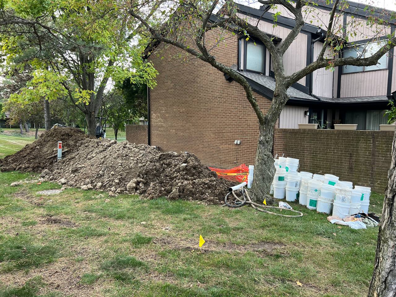 Waterproof membrane installation on exposed foundation wall
