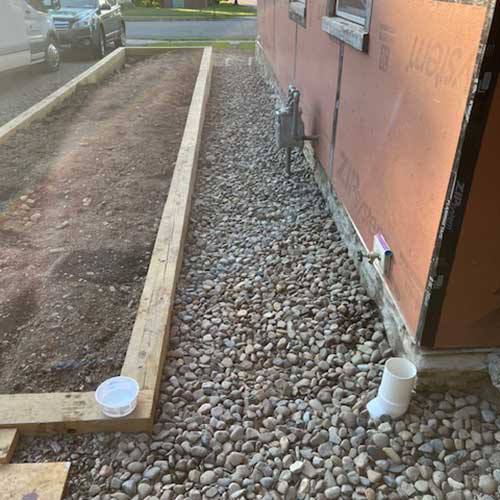 Yard slope correction and regrading for drainage
