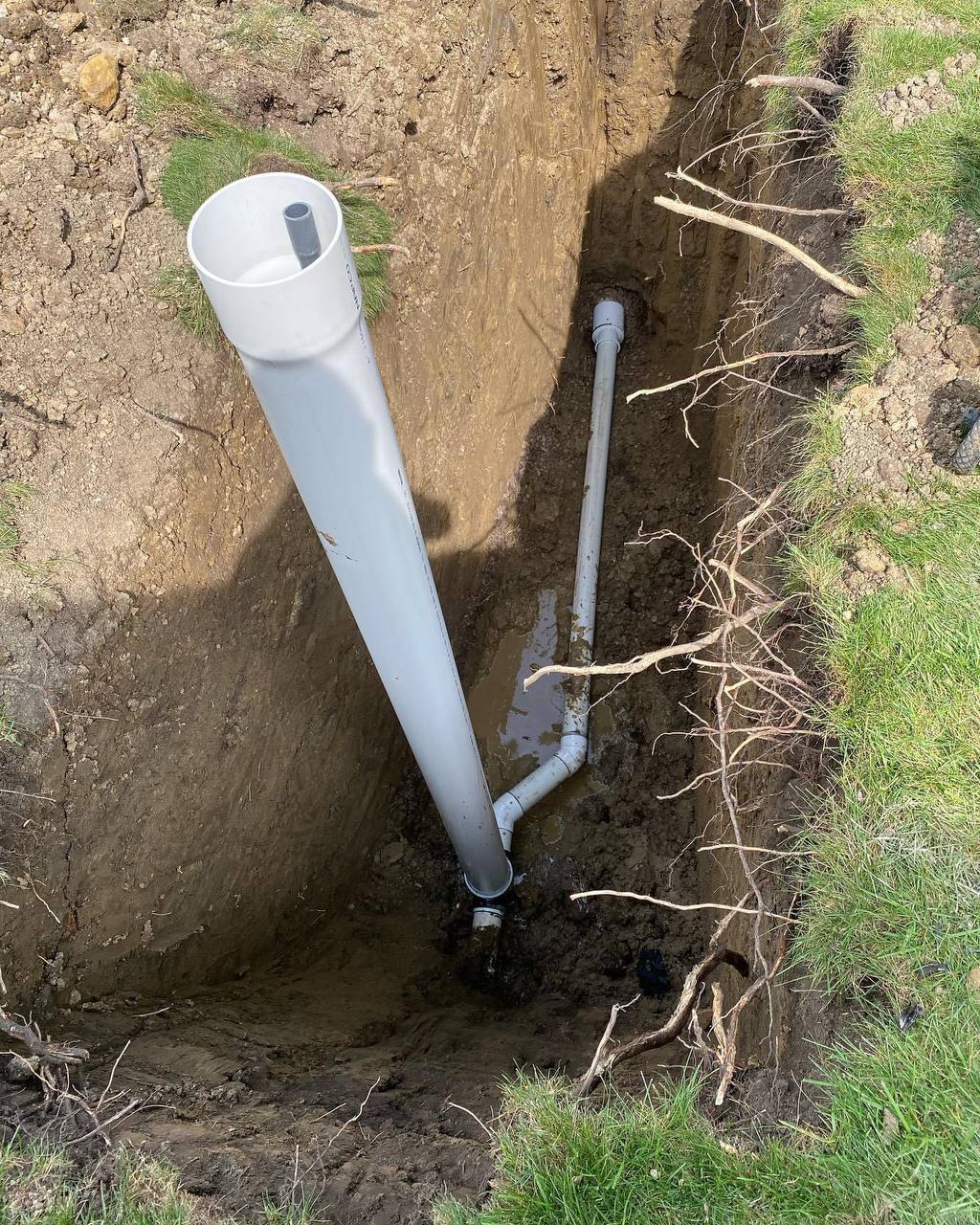 Professional sewer line excavation and pipe repair work in progress